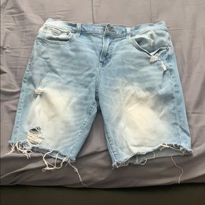 Distressed medium wash jean shorts